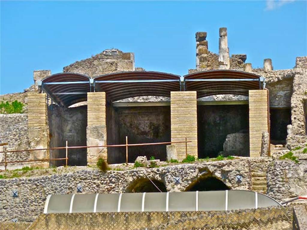 VII.16.13 Pompeii. May 2011. Looking east from rear, towards rooms on the lower level after roofing and restoration. Room 33 can be seen unroofed on the left, followed by roofed rooms 32, 31 and 30. The doorway to corridor 40 can be seen on the right.
Photo courtesy of Michael Binns.
