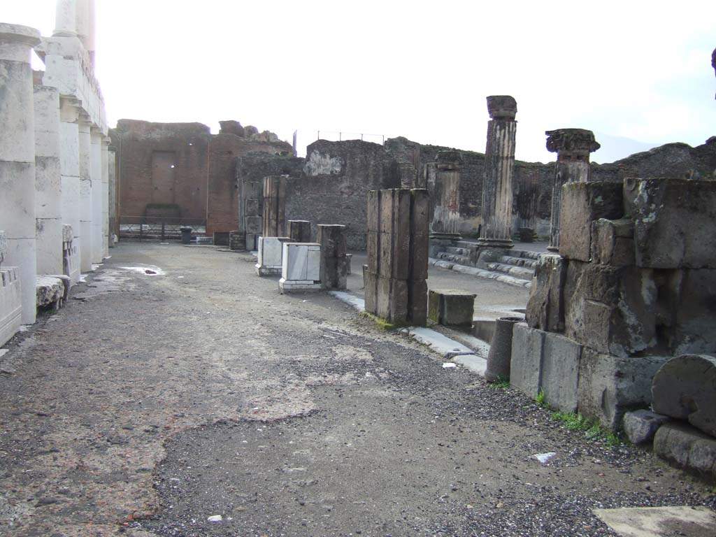 VIII.1.1 Pompeii. December 2005. Looking south along west side of the Forum, with Basilica entrance, on the right.