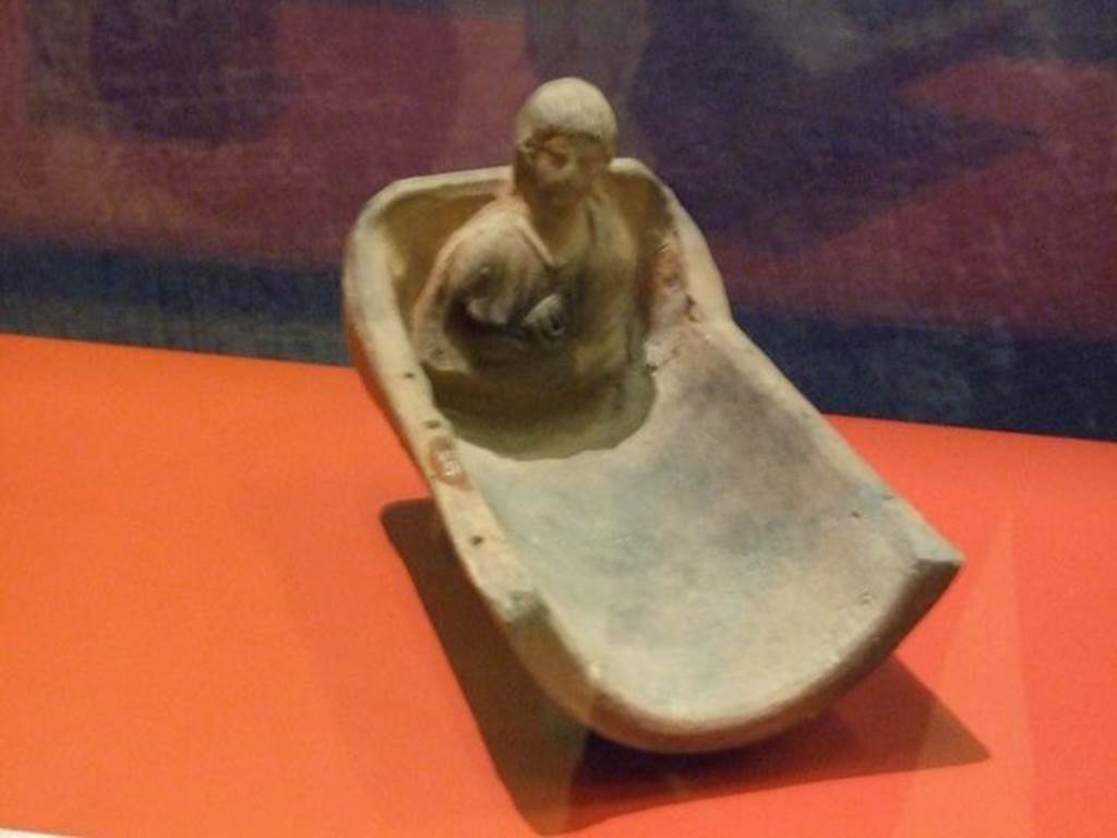 I.14.15 Pompeii. Terracotta altar in the shape of a cradle. SAP inventory number 34973.
Photographed at “A Day in Pompeii” exhibition at Melbourne Museum. September 2009.
