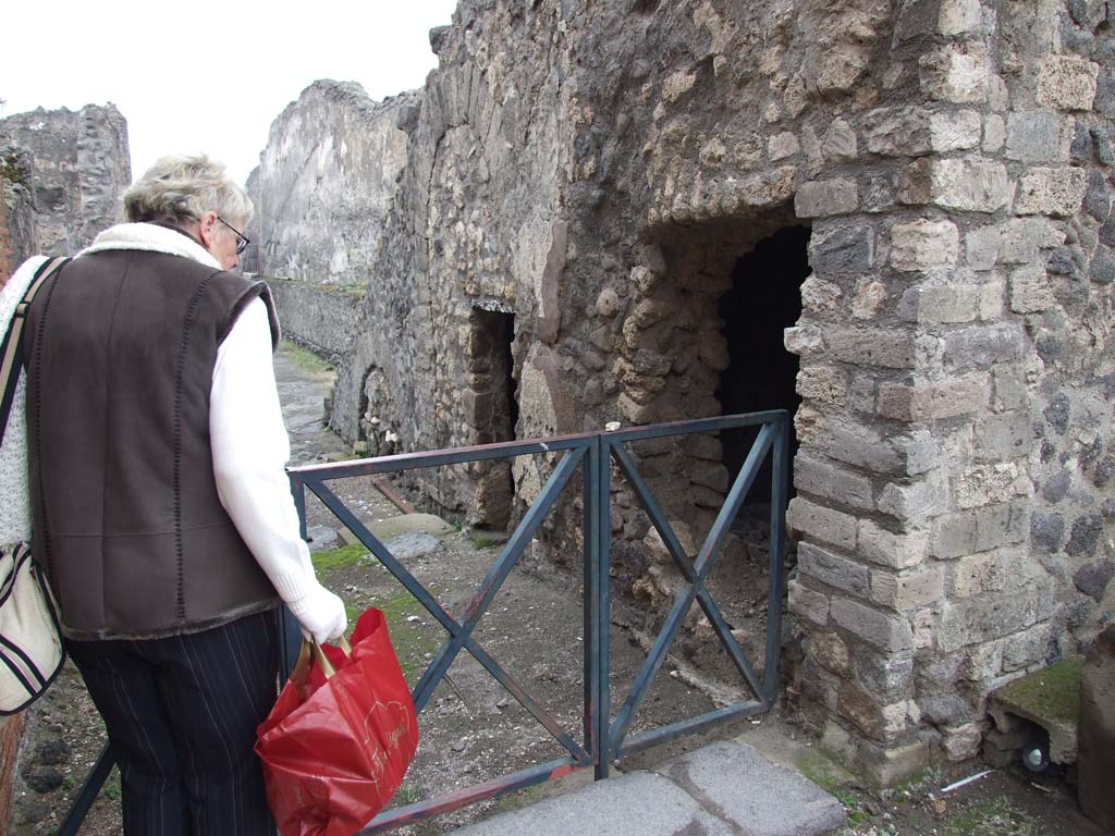 VIII.1.7 Pompeii. December 2007. Looking west along Via Championnet showing entrances under the stone stairs.