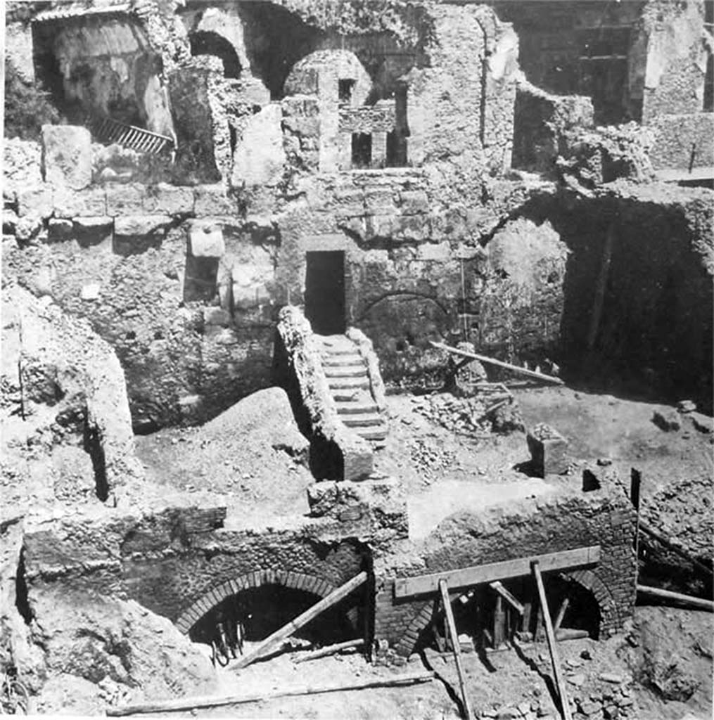 Rear of VIII.2.1 Pompeii. Old undated photograph. Looking north towards rear of Casa di Championnet I.
The house was built over and out from the old city wall, which can be seen in this photograph.
