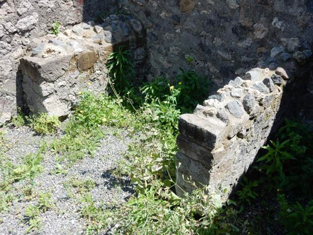 VIII.2.13 Pompeii. May 2018. Structure in middle room on south side, possibly supports for a bench/table. 
Photo courtesy of Buzz Ferebee.

