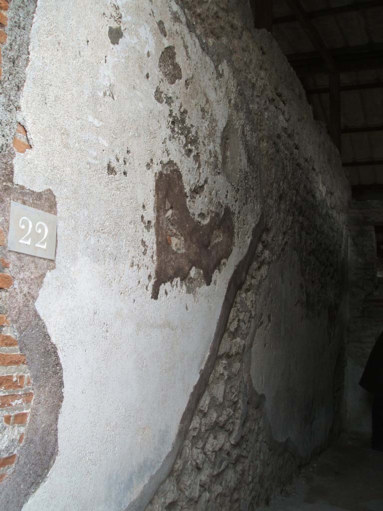 VIII.2.22 Pompeii. December 2004. East wall of entrance of steps to the upper floor.