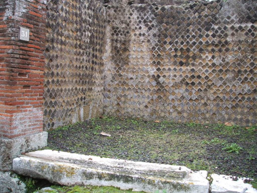 VIII.2.31 Pompeii. December 2005. East wall, south-east corner and south wall of shop.