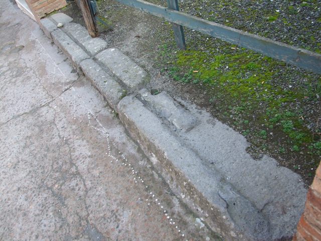 VIII.3.7 Pompeii. December 2007. Threshold or sill.  Mosaic pattern in pavement can be seen in front of the sill.