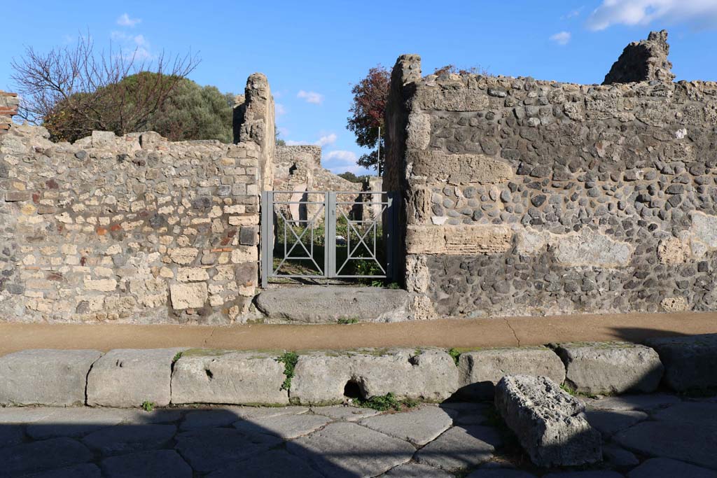 VIII.3.18, Pompeii. December 2018. Looking east from Via delle Scuole towards entrance doorway. Photo courtesy of Aude Durand.