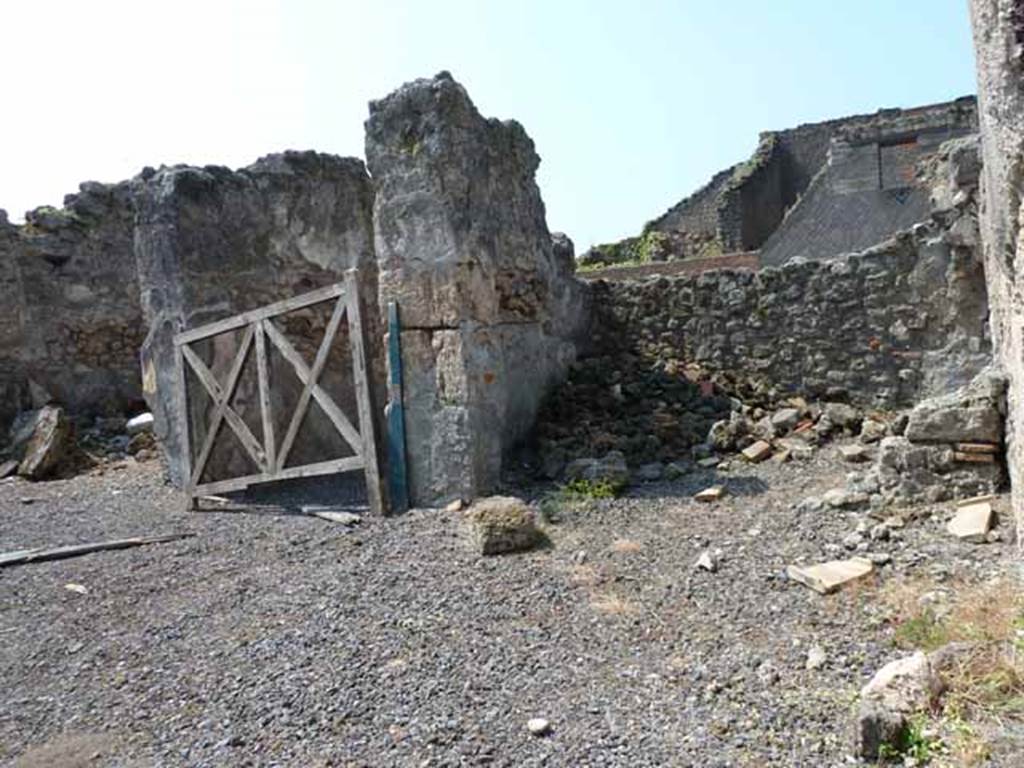 VIII.3.18 Pompeii. May 2010. West side of atrium, with a cubiculum on both sides of entrance corridor.
Looking south-west across atrium towards cubiculum on north side of entrance doorway, on right. Taken from VIII.3.19. 
