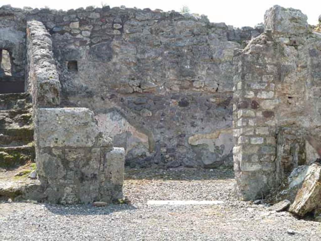 VIII.3.18 Pompeii. May 2010. Looking south to doorway to triclinium in south-west corner of atrium.Taken from VIII.3.19. 