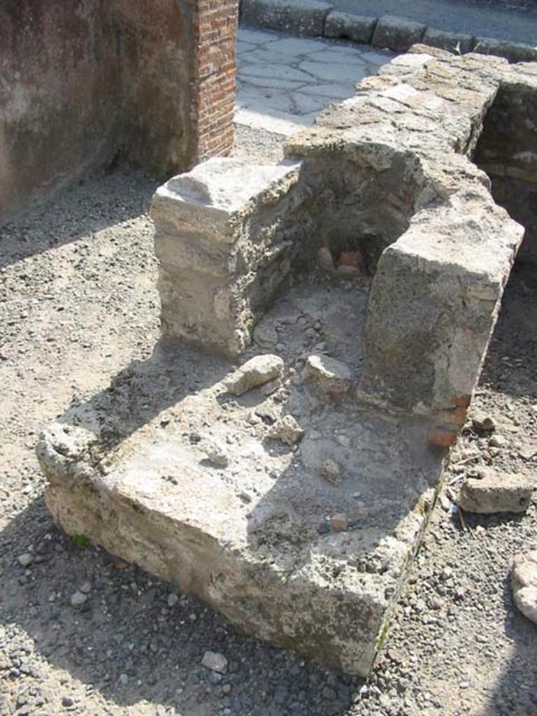 VIII.3.22 Pompeii. May 2003. Hearth at east end of counter. Photo courtesy of Nicolas Monteix.
