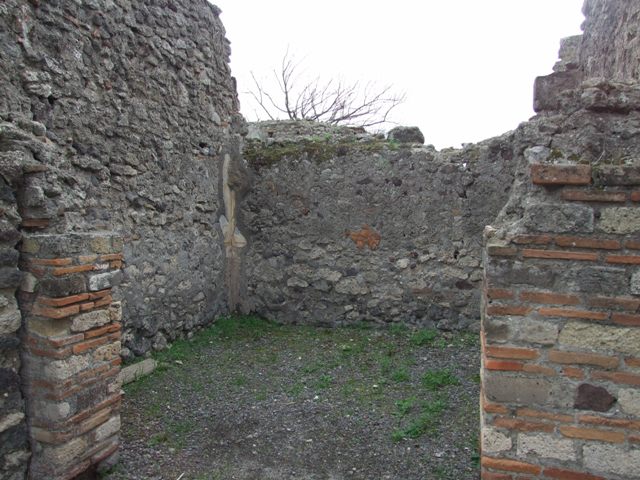 VIII.3.27 Pompeii. December 2007.  South-east corner with VIII.3.24 in background.
The remains of a room on the left centre would have belonged to the kitchen rooms.
The kitchen wall can be seen on the right. The broken wall, in the centre on the right, would appear to lead into a long room on the south side of the kitchen rooms, and seems to be part of VIII.3.24.

