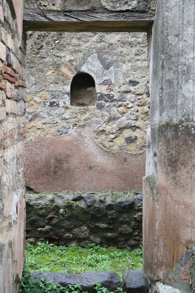 VIII.4.4, Pompeii. December 2018. 
Doorway to room 7, kitchen. Looking towards east wall with niche.
Photo courtesy of Aude Durand.

