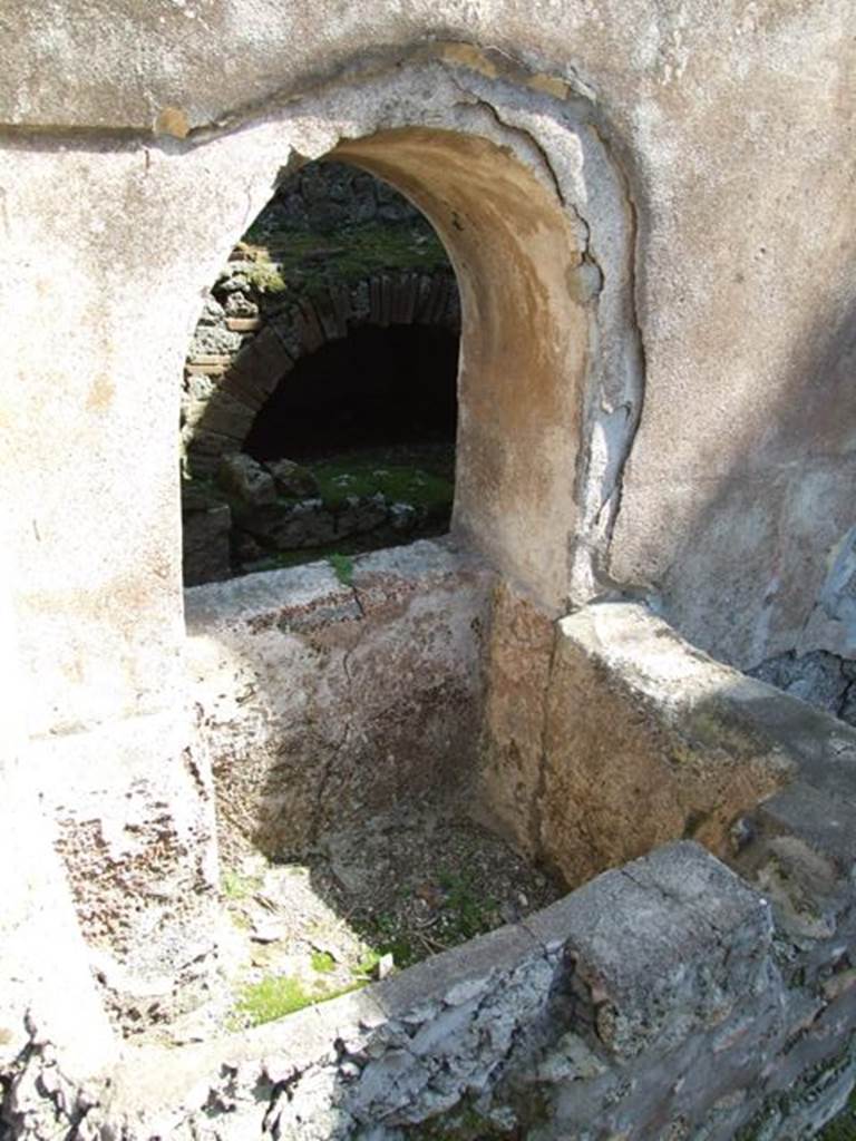 VIII.4.4 Pompeii.  March 2009.  Room 8.  Corridor on west side of kitchen, with square basin, beneath arched opening.