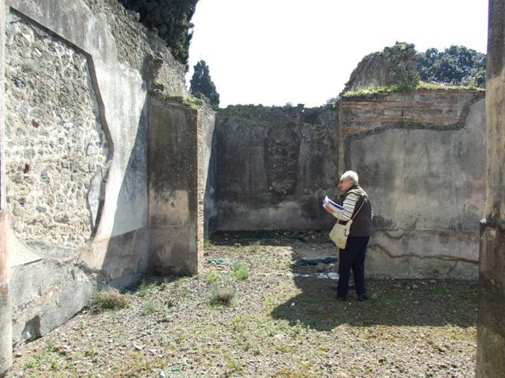 VIII.4.4 Pompeii.  March 2009.  Looking south across south portico to doorway of Room 10, Triclinium.  