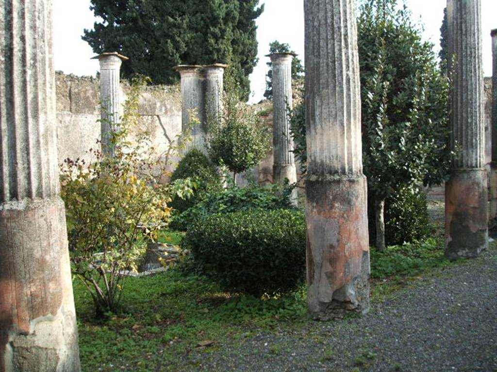 VIII.4.4 Pompeii.  December 2004.  Looking south east across peristyle from VIII.4.49.