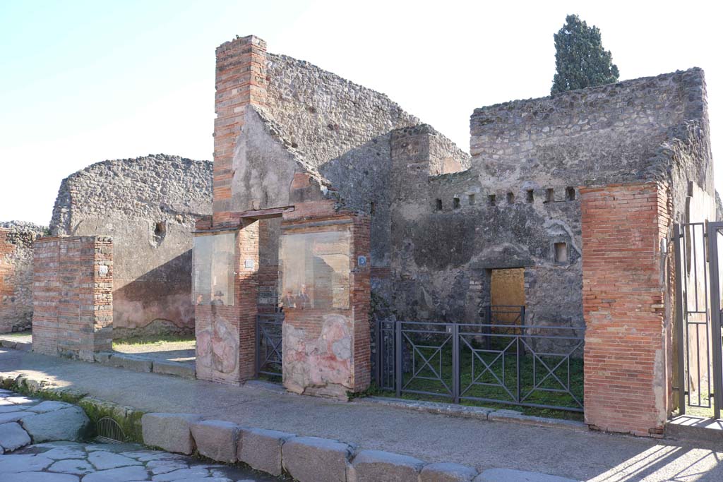 VIII.4.7, VIII.4.6, and VIII.4.5 Pompeii, right of centre. December 2018. 
Looking to entrance doorways on south side of Via dell’Abbondanza. Photo courtesy of Aude Durand.

