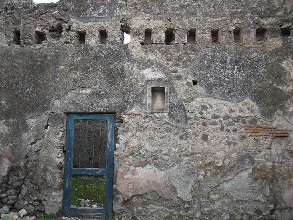 VIII.4.5 Pompeii. December 2006. South wall of shop, with doorway to room joined to VIII.4.4.  