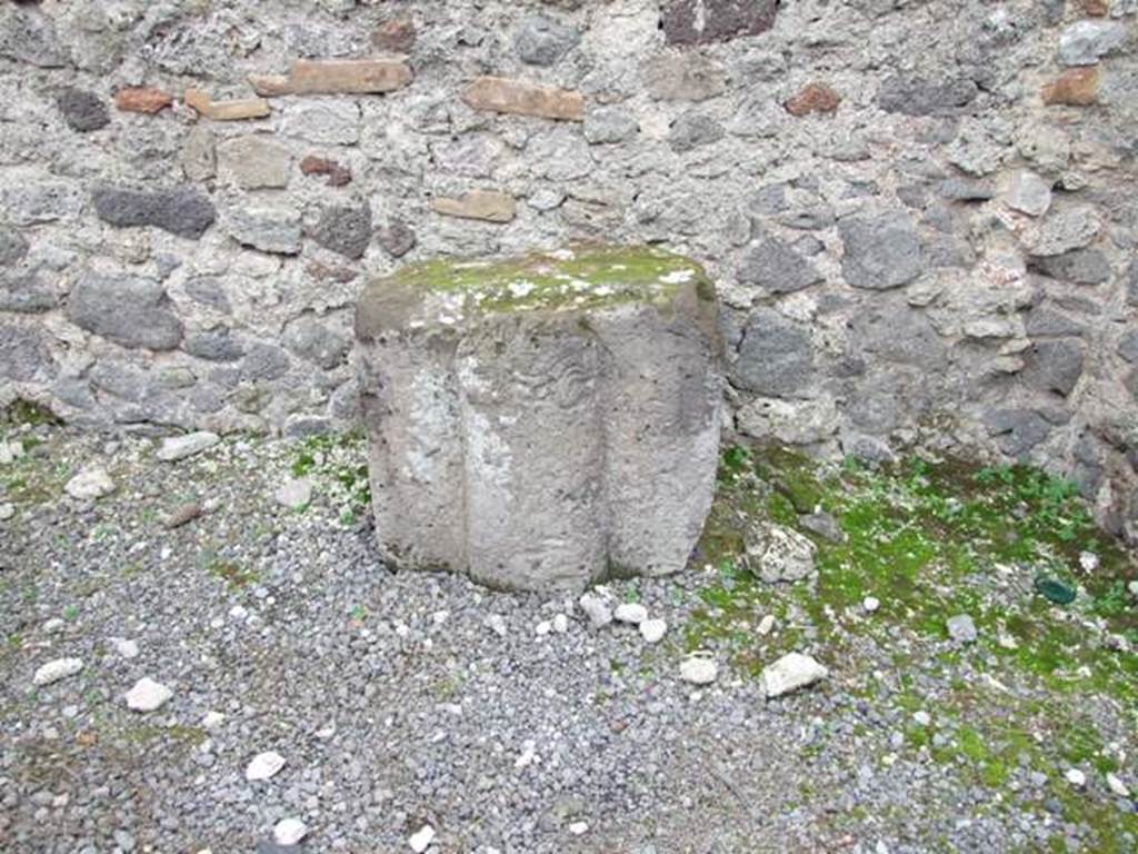 VIII.4.20 Pompeii.  Shop and rooms.  December 2007.  Tufa block with relief.
