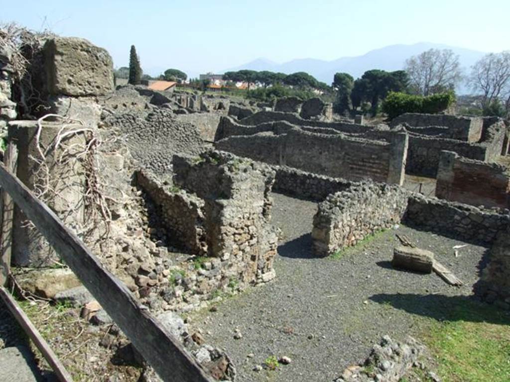 VIII.4.29 Pompeii. March 2009.   Pompeii.  Looking south east from south portico of  VIII.4.15, onto lower level and the rear rooms of VIII.4.27 which looked onto garden area.
