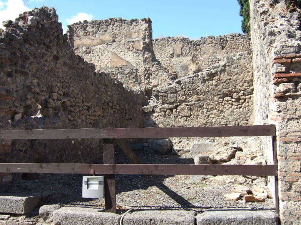 VIII.4.35 Pompeii.  Shop and room.  September 2005. Entrance showing, on left site of former steps to upper floor, and on right the shop sill.