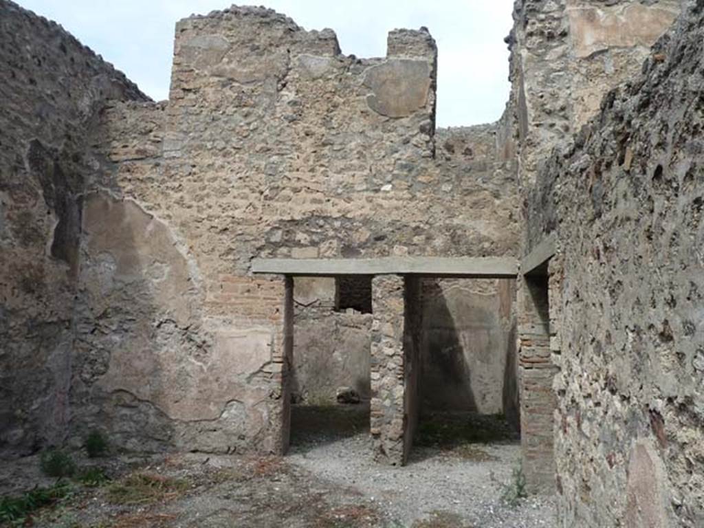VIII.4.37 Pompeii. September 2015. North wall of courtyard with two doorways on lower level and two doorways on upper level.