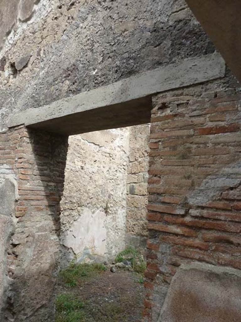 VIII.4.37 Pompeii. September 2015. Doorway in east wall to triclinium with window.
