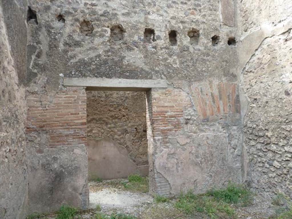 VIII.4.37 Pompeii. September 2015. West wall of triclinium, with doorway returning to small room/cupboard.