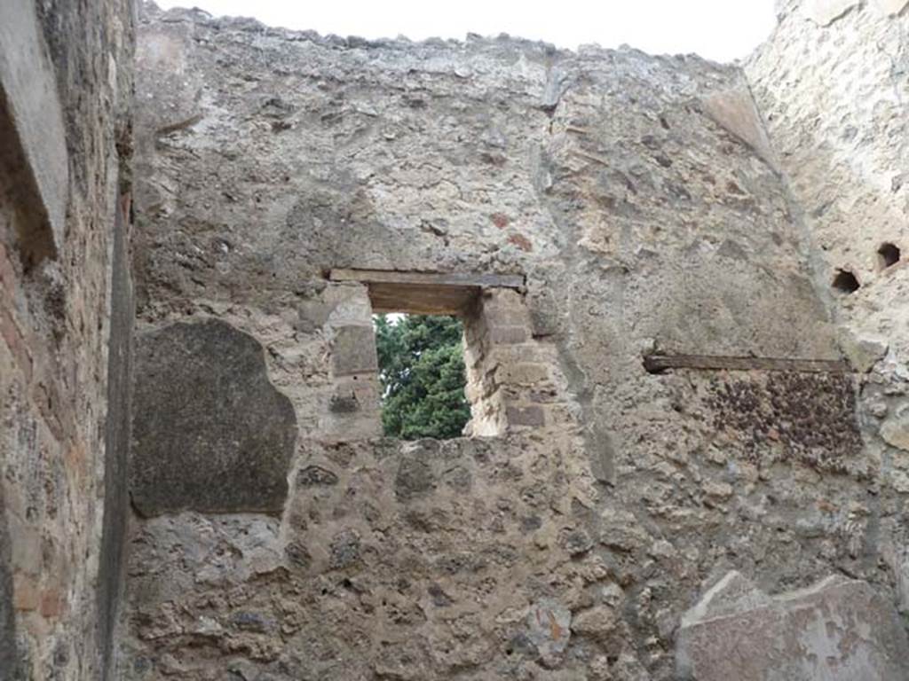 VIII.4.37 Pompeii. September 2015. West wall with window into the lightyard of VIII.4.39.