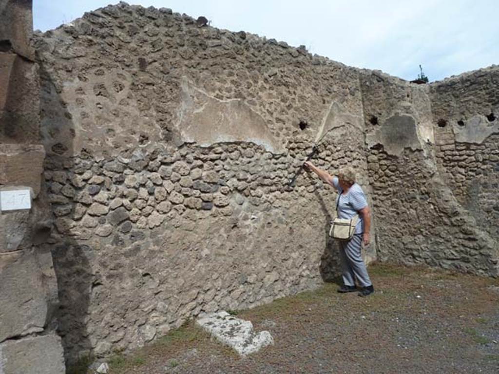 VIII.4.47 Pompeii. September 2015. North wall, with stone base to stairs, and line of stairs visible in the remaining plaster.