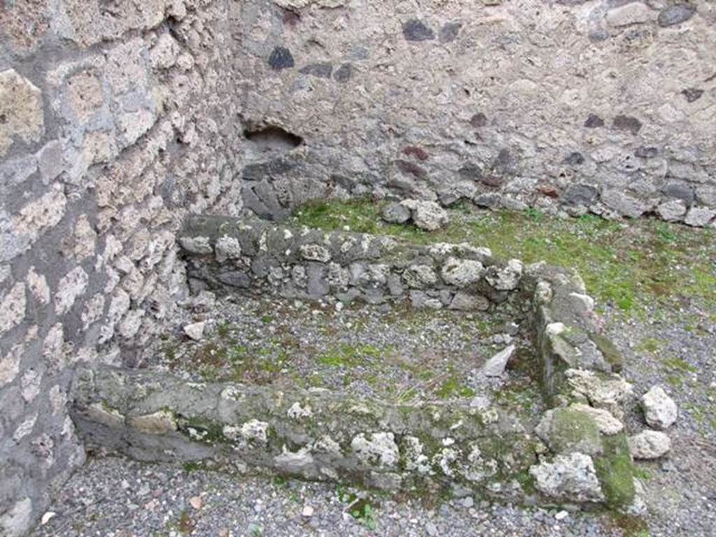 VIII.4.48 Pompeii. December 2007. Looking south to remains of vat or tub, and latrine in south-east corner of shop. 

