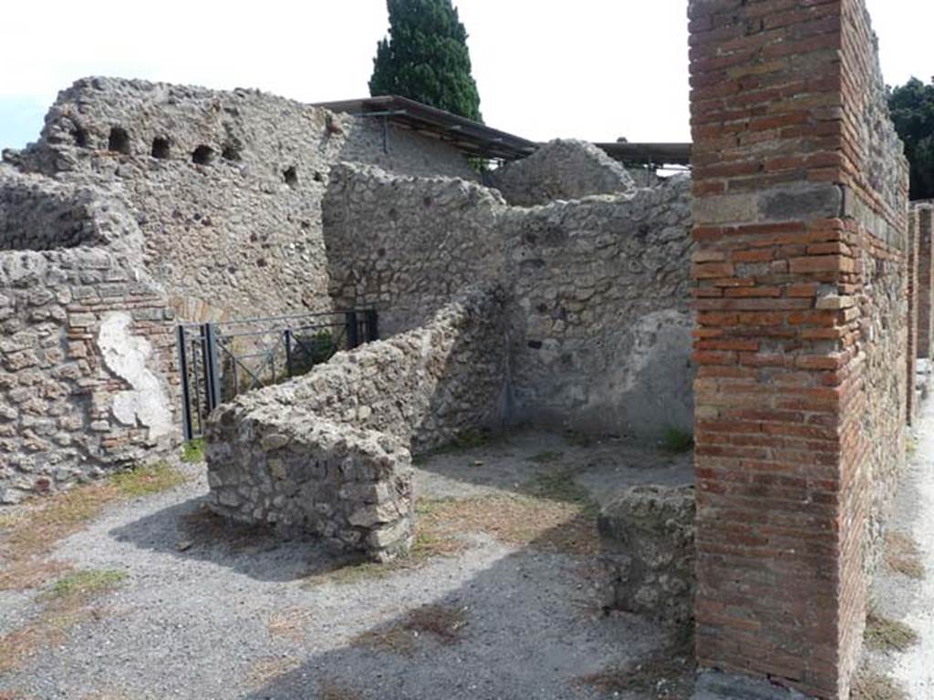 VIII.4.53 Pompeii. September 2015. Looking south-east across shop, towards rear room and workshop area.