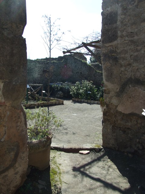 VIII.5.15 Pompeii. March 2009. Room 1, doorway and step to room 2, in south-west corner
