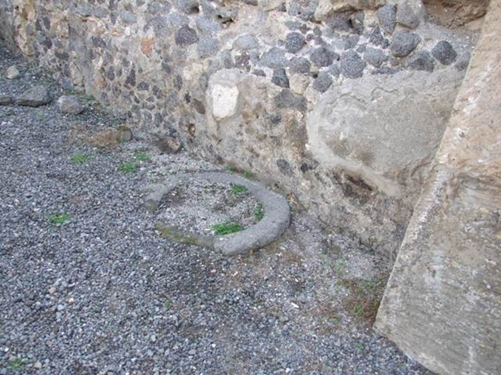 VIII.5.21 Pompeii.  Shop and room.  December 2007.   Cistern or well head next to west wall.