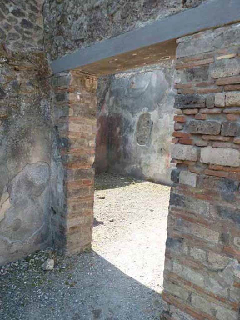 VIII.5.24 Pompeii. May 2010. Doorway to room 13, large oecus in south-west corner of west portico.