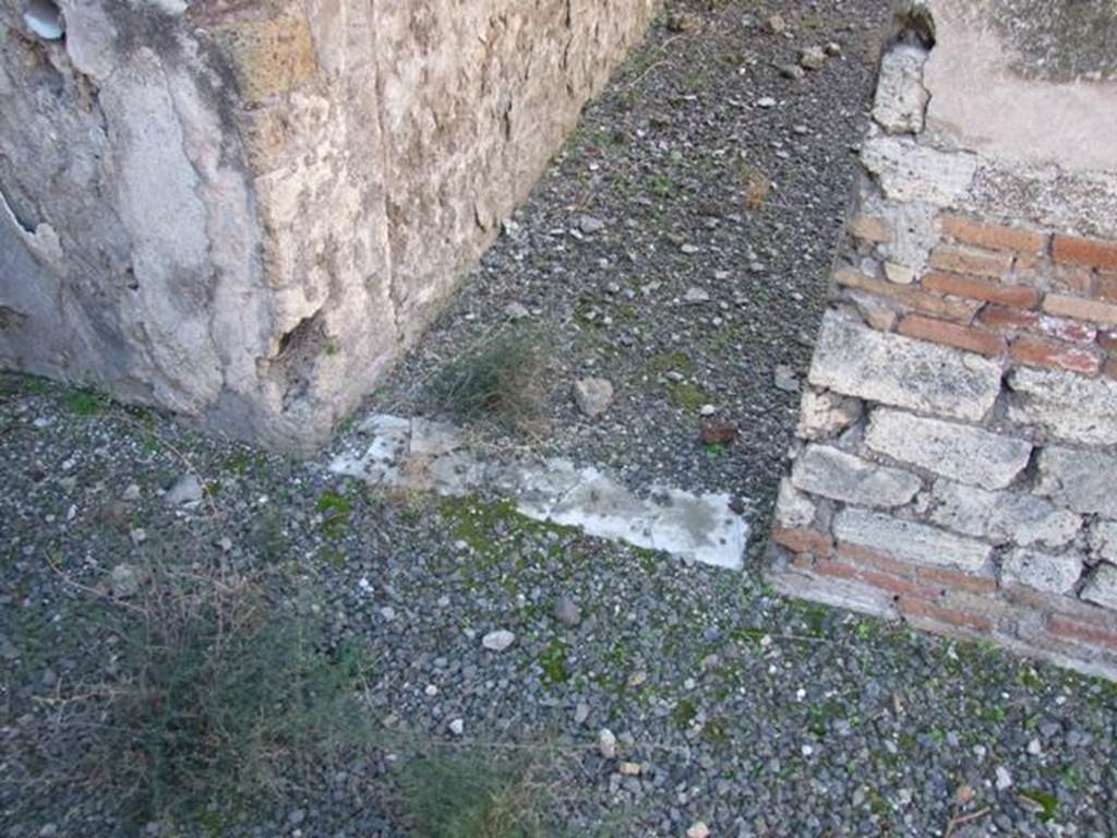 VIII.5.28 Pompeii.  March 2009.  Sill of small doorway to Room 11.