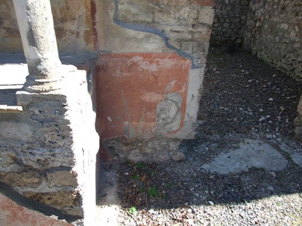 VIII.5.37 Pompeii.  March 2009.  Painted plaster on south side of podium of Lararium .
