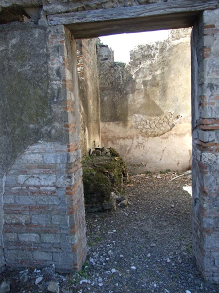 VIII.5.37 Pompeii. March 2009. Doorway to room 15, looking west into kitchen.