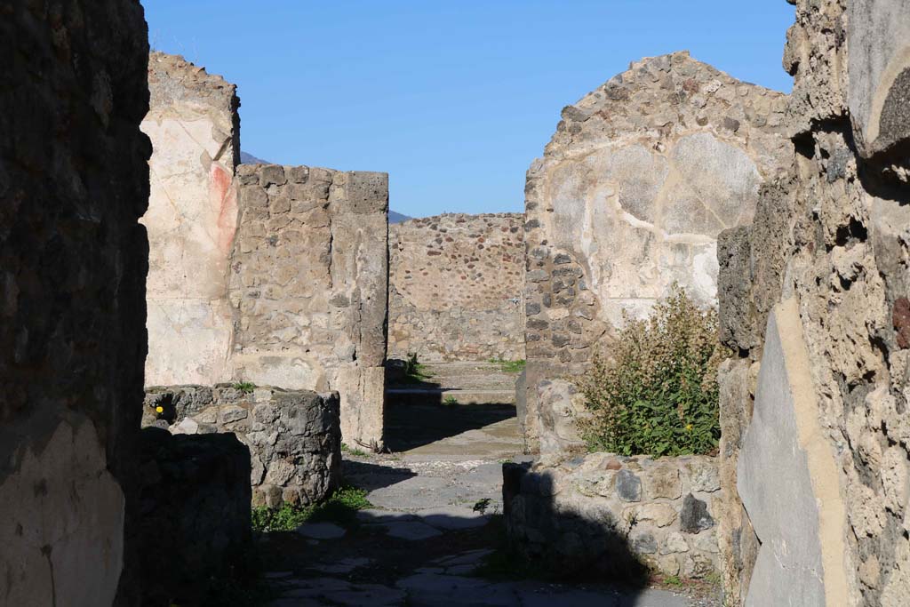 VIII.6.1, Pompeii. December 2018. 
Looking north from entrance corridor and across bakery room towards rooms at rear, see VIII.6.10. Photo courtesy of Aude Durand.
