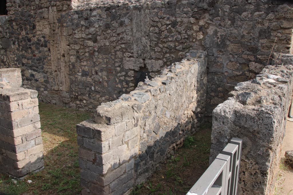 VIII.6.4 Pompeii. October 2023. 
Looking from entrance doorway, on the right of the entrance corridor, are the doorways to stairs, and a small storeroom with two doorways.
Photo courtesy of Klaus Heese.
