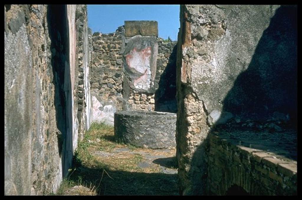 VIII.6.11 Pompeii. Looking east towards bakery from kitchen with hearth. Photographed 1970-79 by Günther Einhorn, picture courtesy of his son Ralf Einhorn.
According to Mau, the threshold of the kitchen doorway apparently was made of wood.
See BdI, 1884, p.139

