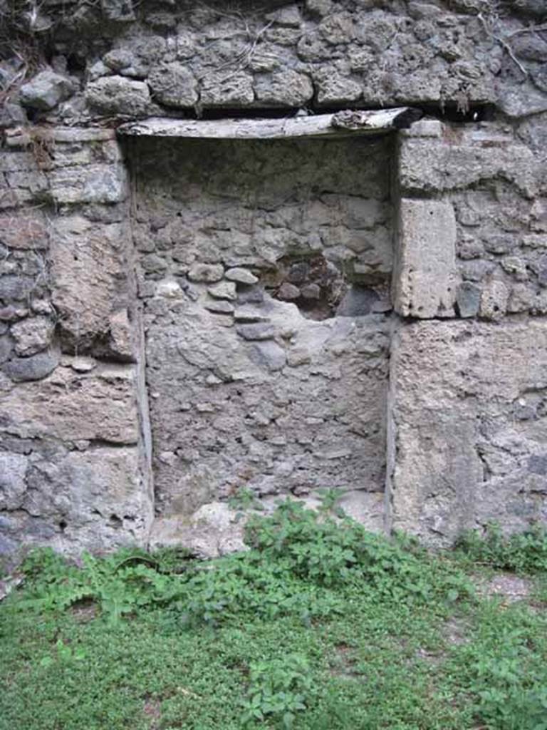 VIII.7.6 Pompeii. September 2010.  North wall of large triclinium with large recess, or blocked doorway to corridor. Photo courtesy of Drew Baker.
