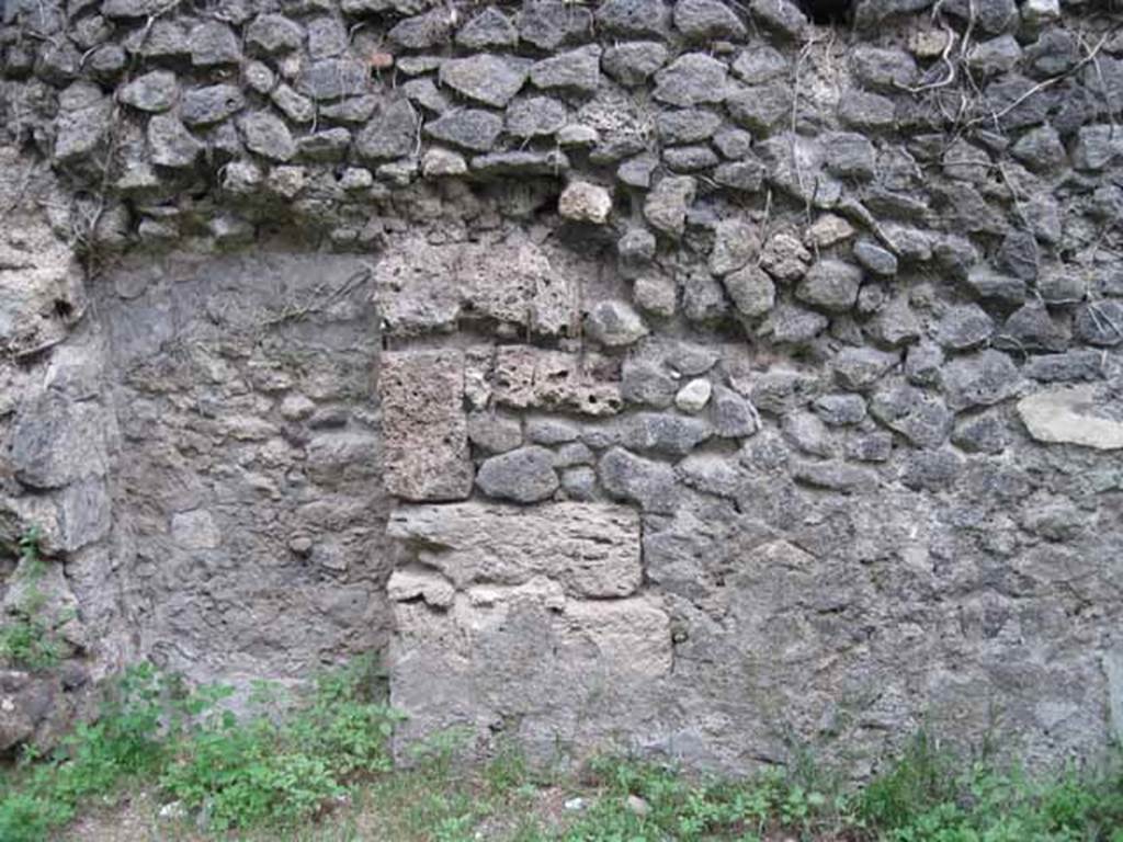 VIII.7.6 Pompeii. September 2010. North wall of oecus, with detail of blocked doorway. Looking north. Photo courtesy of Drew Baker.
