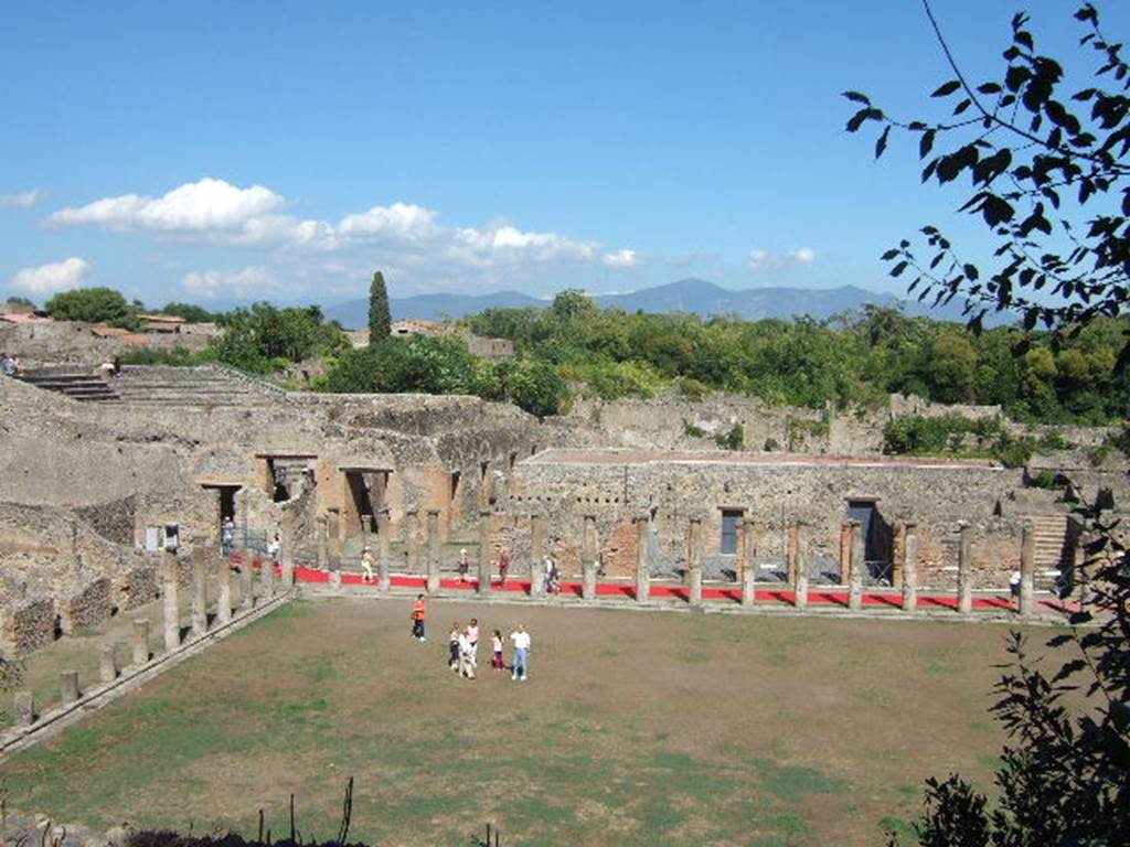 VIII.7.16 Pompeii. Photo possibly by Sommer and Son. Looking north-east across north end of Gladiator’s Barracks towards the Large Theatre, from Triangular Forum. 
Used with the permission of the Institute of Archaeology, University of Oxford. File name instarchbx208im 091. Resource ID. 44417.
