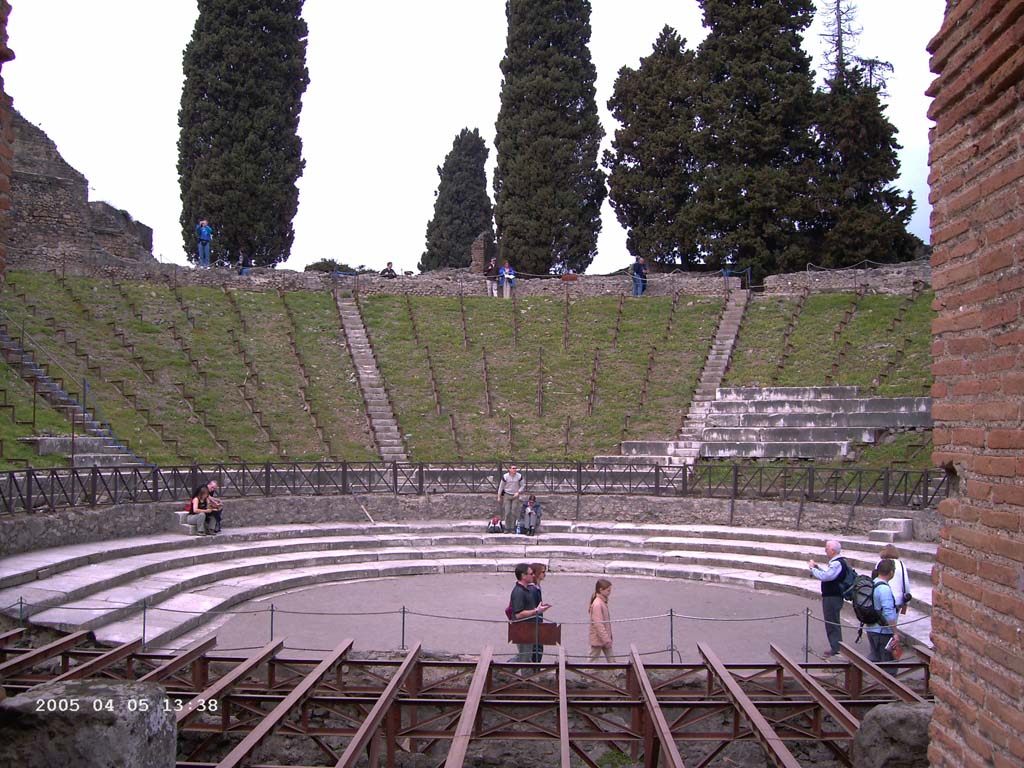 VIII.7.20 Pompeii. May 2006. Entrance corridor to Large Theatre. On the left can be seen the entrances to the steps at the rear of the Little Theatre or Odeon.