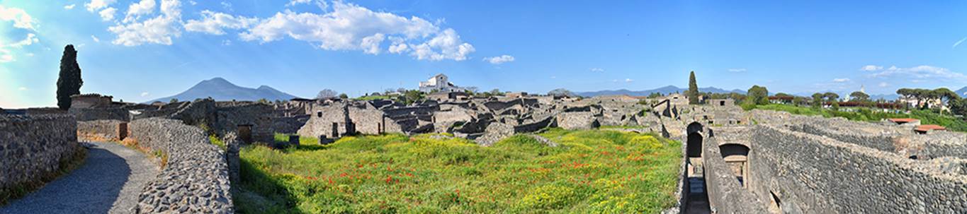 VIII.7.21 Pompeii, on left. April 2018. 
Looking north-east from upper level of large theatre towards Vesuvius, across garden of VIII.7.26 and 24 and with the passages to theatres, on the right. Photo courtesy of Ian Lycett-King. Use is subject to Creative Commons Attribution-NonCommercial License v.4 International.

