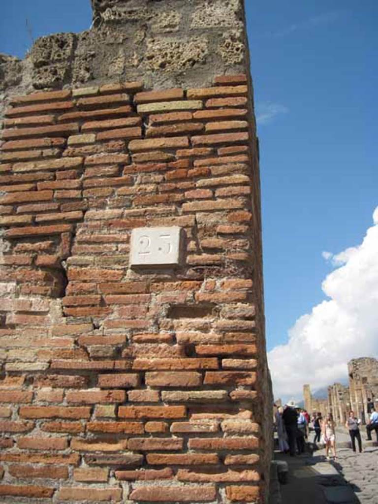 VIII.7.23 Pompeii. September 2010. ID number plate on north side of entrance. Looking north along Via Stabiana. Photo courtesy of Drew Baker.
