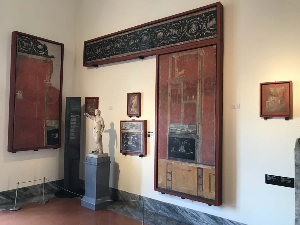 VIII.7.28 Pompeii. April 2019. West part of north portico. 
Top is fresco with a continuous sequence of scrolls and acanthus scrolls.
Now in Naples Archaeological Museum. Inventory number 8553.
Large panel to the right is a naval scene in architectural setting.
Now in Naples Archaeological Museum. Inventory number 8529.
Photo courtesy of Rick Bauer.
