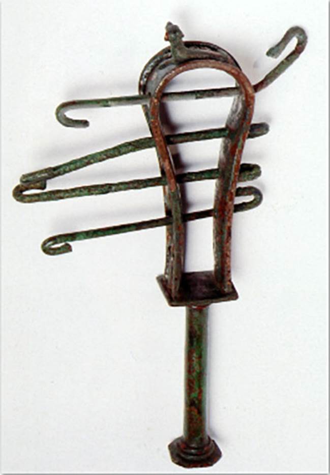 VIII.7.28 Pompeii. The instrument was found on January 4th, 1766 in the Ekklesiasterion.
The sistrum is adorned on the top with a crouched cat and on the sides with lotus flowers. 
It was found together with some marble fragments of limbs, among which some of the hand that originally held it and of a marble head of Isis.
Now in Naples Archaeological Museum. Inventory number 2397.

Now in Naples Archaeological Museum. Inventory number 409AE.

