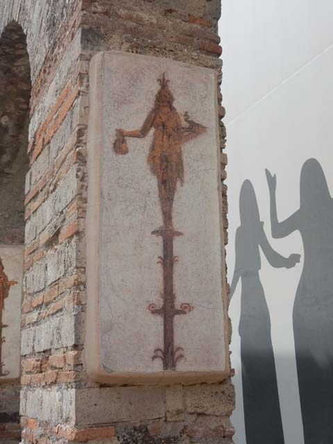 VIII.7.28 Pompeii. May 2017. Reproduction fresco on south wall of second arch from north in the Ekklesiasterion.
Priestess on a candelabrum with jar and peacock. 
Now in Naples Archaeological Museum. Inventory number 8915.
Photo courtesy of Buzz Ferebee.

