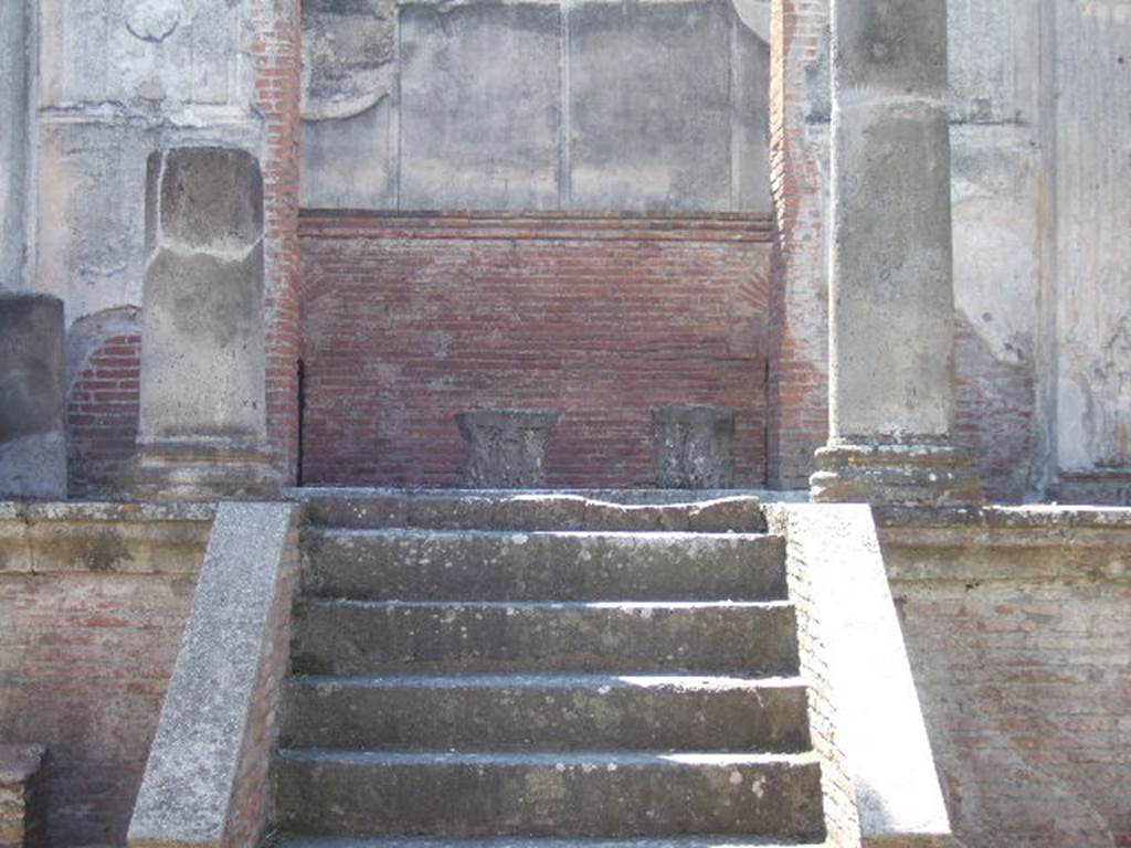 VIII.7.28, Pompeii. May 2015. Looking west towards cella, with remains of decorative stucco on front wall on both sides of doorway. Photo courtesy of Buzz Ferebee.
