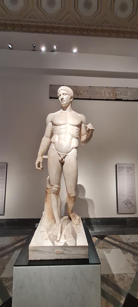 VIII.7.29 Pompeii.    Found at the foot of one of the columns on the south side. Statue of the doryphorus (lance- bearer), a Roman replica of the Greek masterpiece in bronze by Policletus or Polyclitus.  (450 B.C.).  See Mau, A., 1907, translated by Kelsey F. W. Pompeii: Its Life and Art. New York: Macmillan. (p.166-7).   Now in Naples Archaeological Museum. Inventory number 6011.